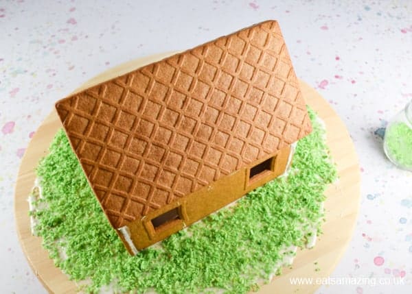 How to make an Easter gingerbread house - Step 2 add green coconut grass